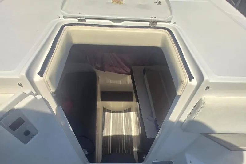  Yacht Photos Pics 2016 Extreme Boats cabin interior with open hatch, showcasing seating and storage.