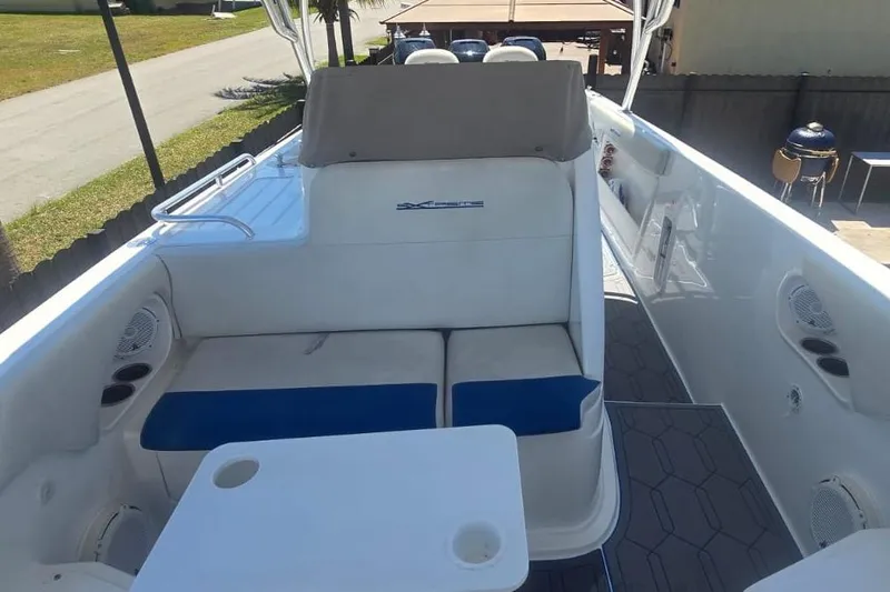  Yacht Photos Pics 2016 Extreme Boats interior with cushioned seating and table, featuring modern design elements.