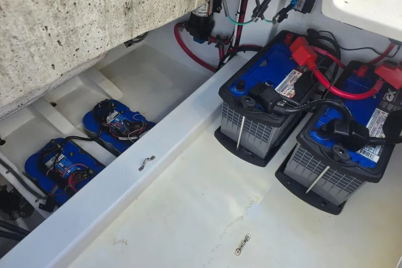  Yacht Photos Pics Battery compartment of a 2016 Extreme Boats model, featuring multiple marine batteries.