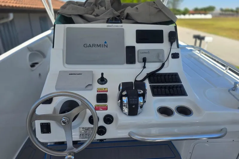  Yacht Photos Pics Control panel of a 2016 Extreme Boats model featuring Garmin navigation and Mercury controls.
