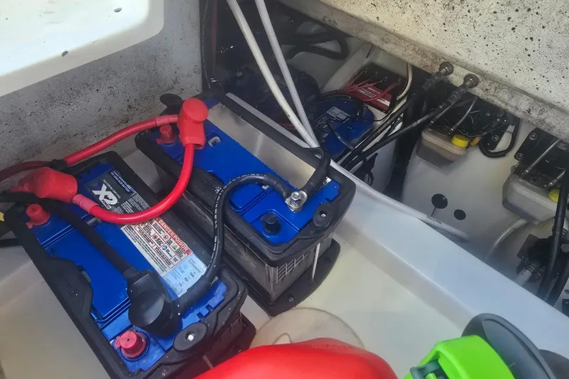  Yacht Photos Pics Batteries and wiring inside a 2016 Extreme Boats model, showcasing marine electrical setup.