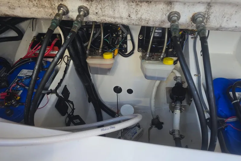  Yacht Photos Pics Engine compartment of a 2016 Extreme Boats model, showcasing wiring and fluid reservoirs.