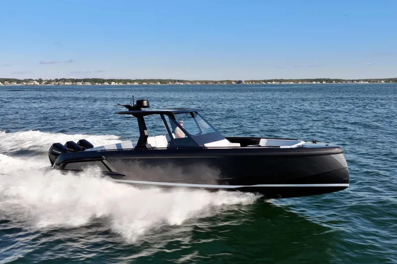 Liberty Yacht Photos Pics 2024 Vanquish Yachts VQ40 cruising on open water, showcasing sleek design and powerful performance.