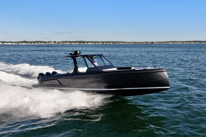 Liberty Yacht Photos Pics 2024 Vanquish Yachts VQ40 cruising on open water, showcasing sleek design and performance.