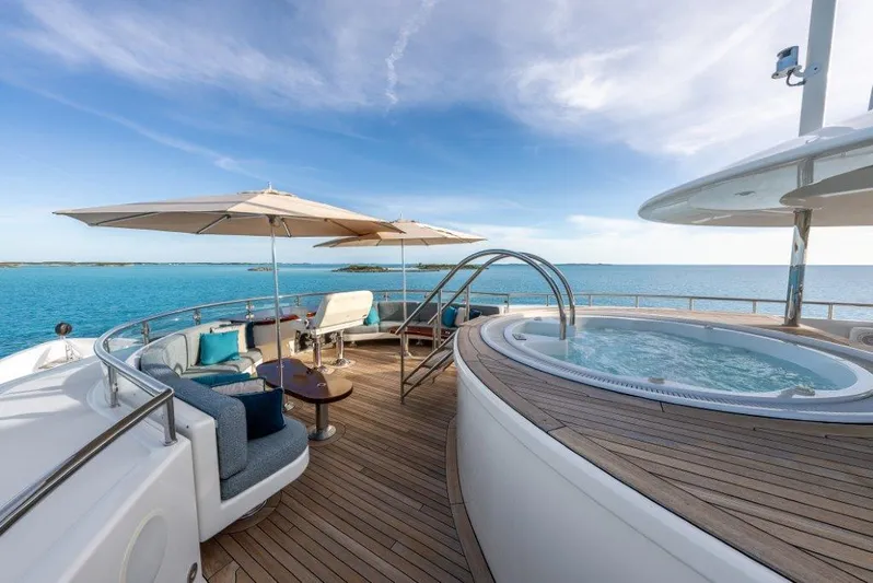 Valinor Yacht Photos Pics Luxurious 2013 Westport W164 yacht deck with jacuzzi and ocean view.