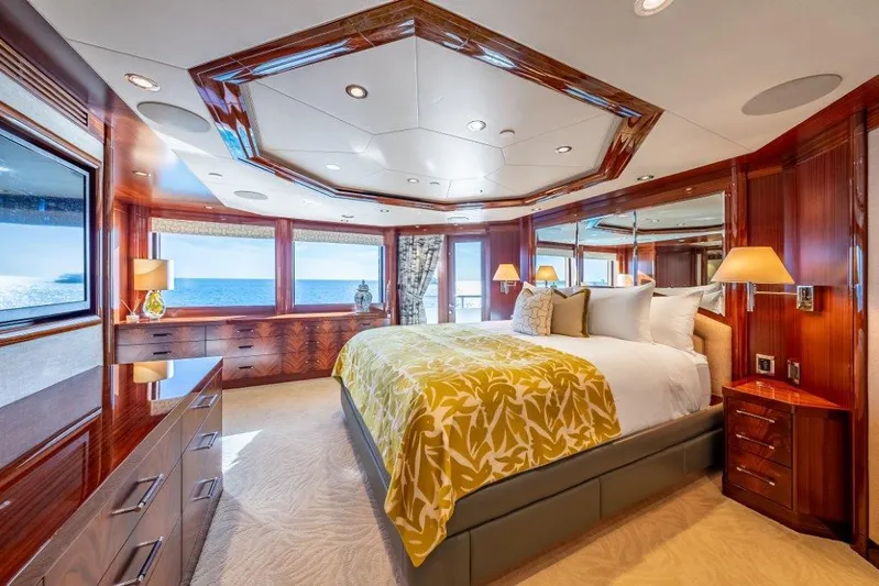 Valinor Yacht Photos Pics Luxurious 2013 Westport W164 yacht bedroom with ocean view, elegant wood finishes, and plush bedding.
