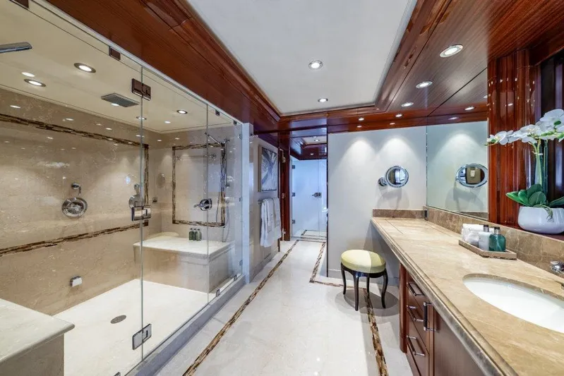 Valinor Yacht Photos Pics Luxurious yacht bathroom with glass shower, marble countertops, and elegant wood accents, Westport W164 2013.