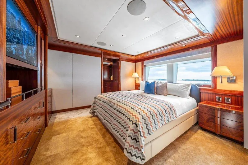 Valinor Yacht Photos Pics Luxurious 2013 Westport W164 yacht bedroom with elegant wood finishes and large window view.