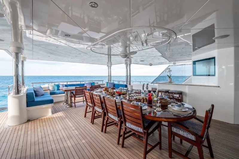 Valinor Yacht Photos Pics Luxurious 2013 Westport W164 yacht deck with elegant dining setup and ocean view.