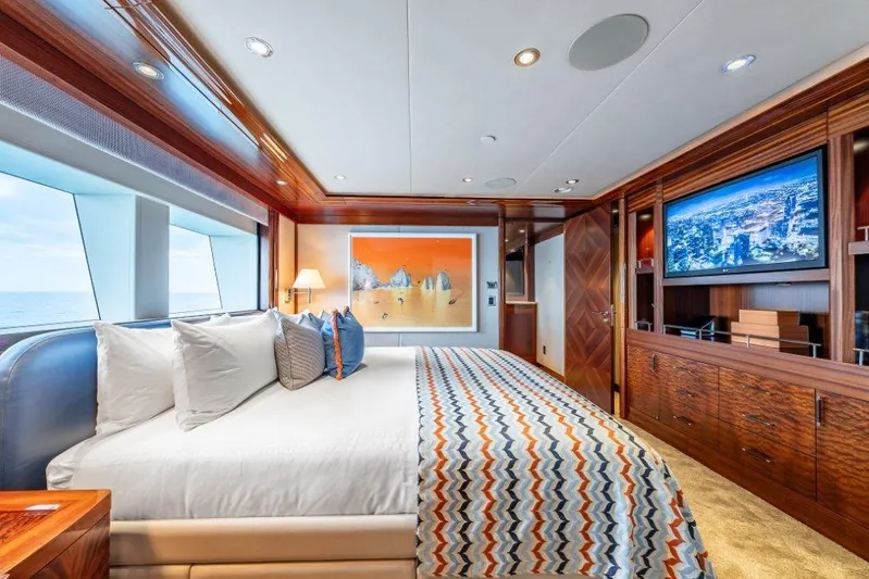 Valinor Yacht Photos Pics Luxurious 2013 Westport W164 yacht bedroom with ocean view, modern decor, and entertainment system.