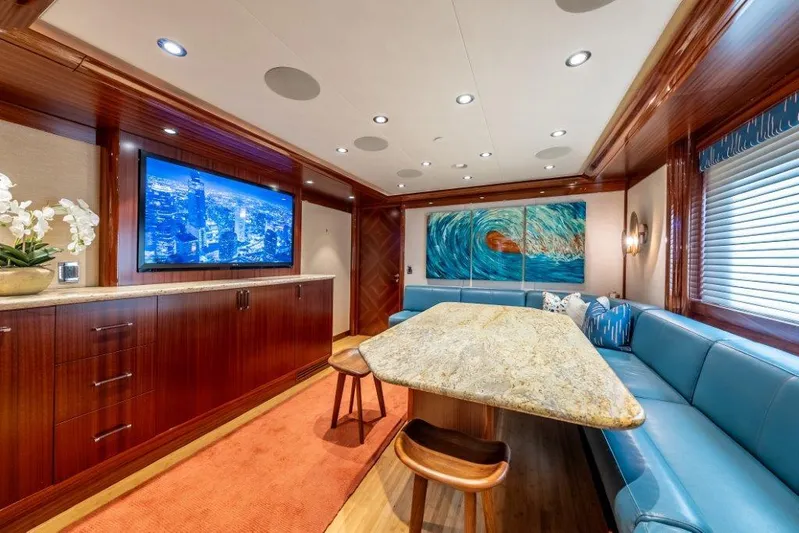 Valinor Yacht Photos Pics Luxurious 2013 Westport W164 yacht interior with elegant seating, large TV, and ocean-themed artwork.