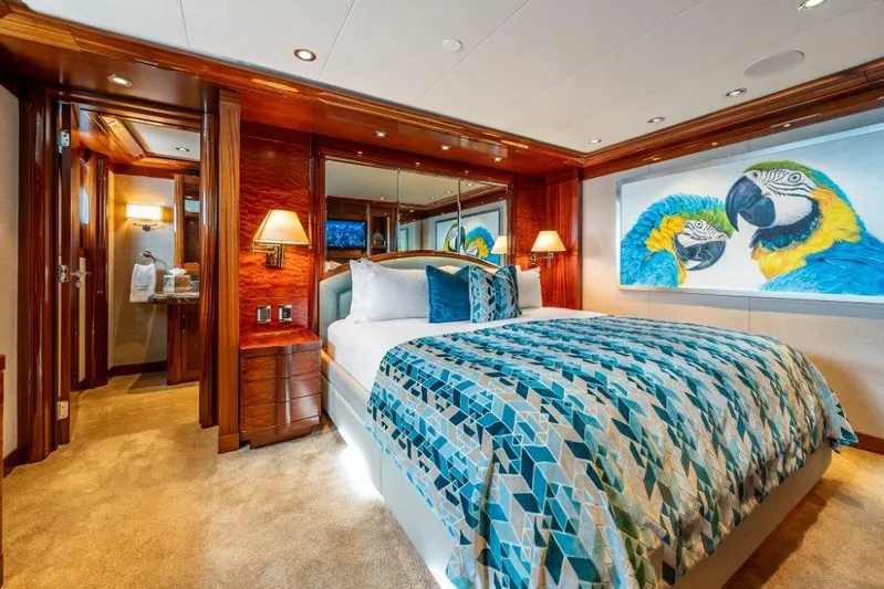 Valinor Yacht Photos Pics Luxurious 2013 Westport W164 yacht bedroom with vibrant parrot artwork and elegant decor.