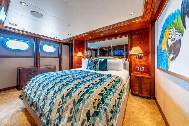 Valinor Yacht Photos Pics Luxurious 2013 Westport W164 yacht bedroom with vibrant decor and elegant wood finishes.