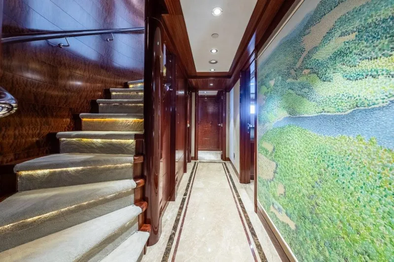 Valinor Yacht Photos Pics Luxurious interior of 2013 Westport W164 yacht with elegant staircase and artwork.