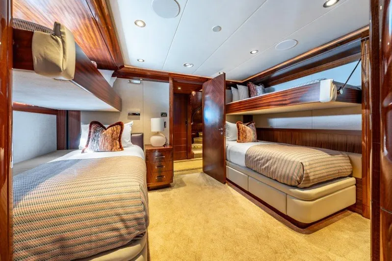Valinor Yacht Photos Pics Luxurious 2013 Westport W164 yacht cabin with twin beds and elegant wood finishes.
