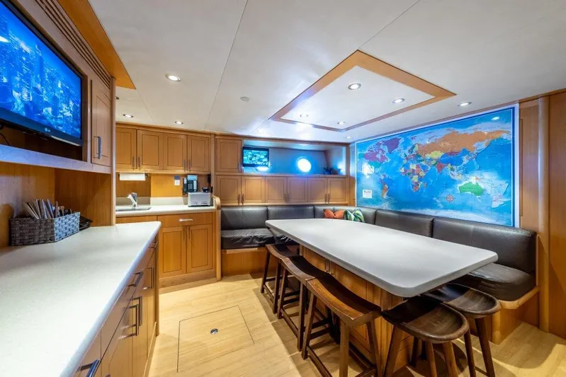 Valinor Yacht Photos Pics Luxurious yacht interior with dining area, world map, and modern kitchen. Westport W164, 2013 model.