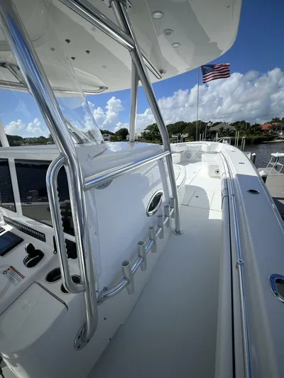 Yacht Photos Pics 2021 Contender 44ST boat deck with American flag, sleek design, and modern features.