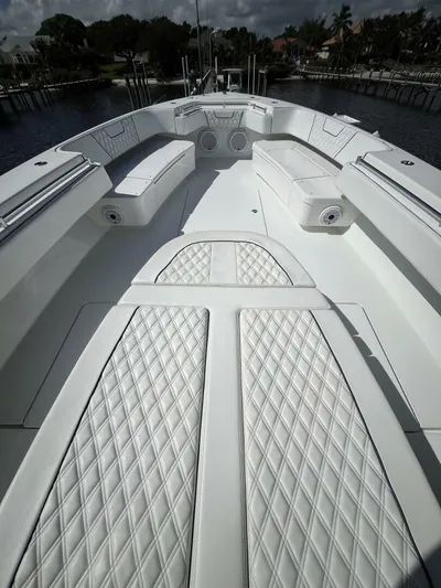  Yacht Photos Pics 2021 Contender 44ST boat with white quilted seating and spacious deck.