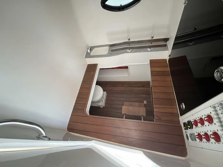  Yacht Photos Pics Contender 44ST 2021 boat interior with wooden flooring and modern fixtures.