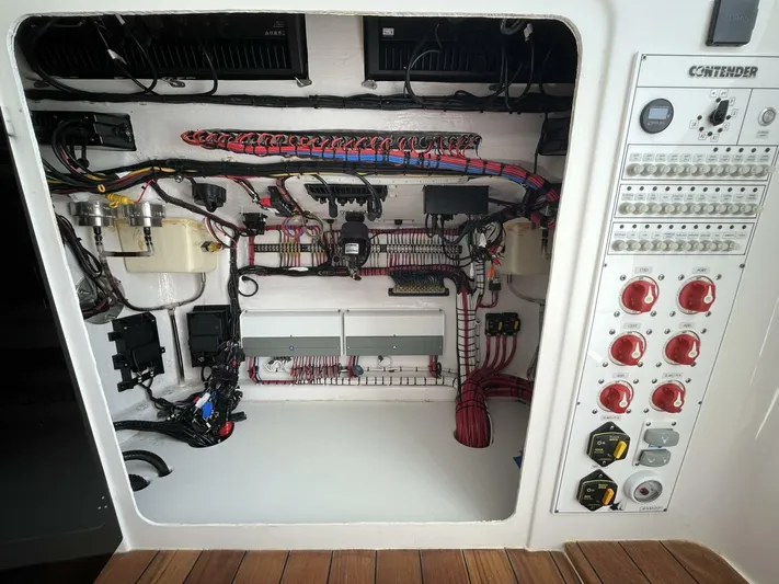  Yacht Photos Pics Contender 44ST 2021 boat electrical panel with wiring and controls.
