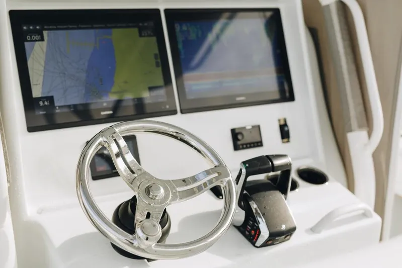 Lunasea Yacht Photos Pics Steering console of 2023 Yellowfin 32 Offshore boat with dual navigation screens.