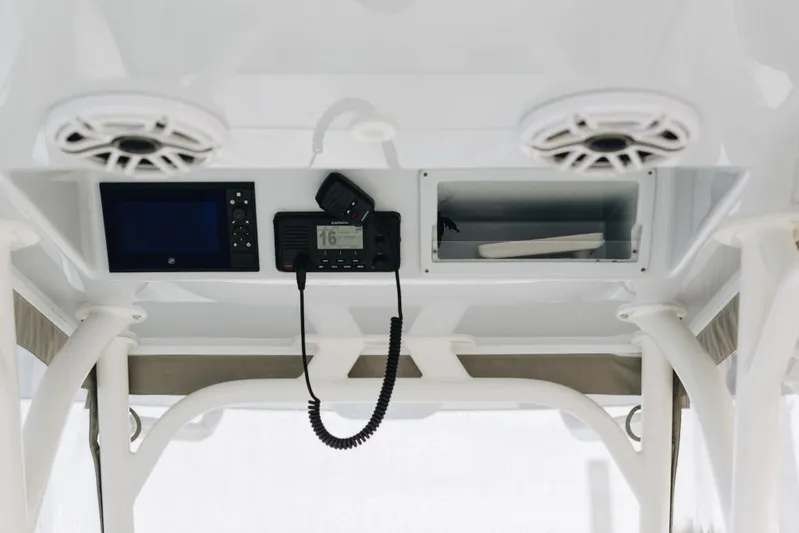 Lunasea Yacht Photos Pics 2023 Yellowfin 32 Offshore boat console with speakers and navigation equipment.