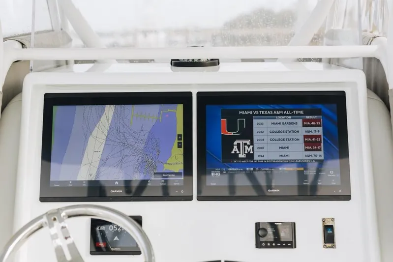 Lunasea Yacht Photos Pics Dashboard of 2023 Yellowfin 32 Offshore with dual Garmin displays showing navigation and sports data.