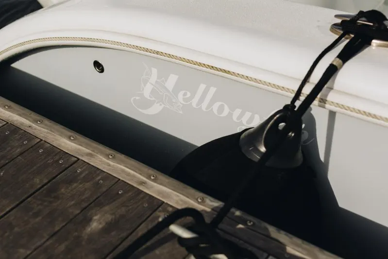 Lunasea Yacht Photos Pics 2023 Yellowfin 32 Offshore boat docked with visible logo and fender.