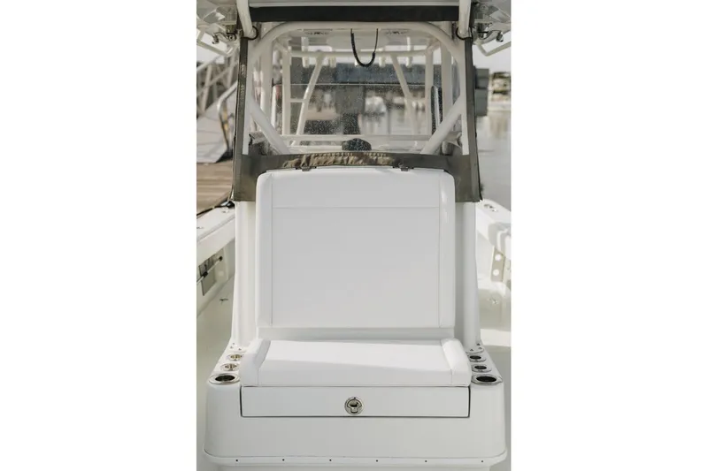 Lunasea Yacht Photos Pics 2023 Yellowfin 32 Offshore boat interior with white seating and cup holders.