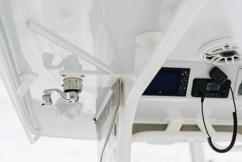 Lunasea Yacht Photos Pics 2023 Yellowfin 32 Offshore boat interior with radio and speaker system.