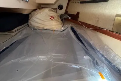 Windragon Yacht Photos Pics Interior cabin of a 1995 Island Packet 37 sailboat with stored sails.