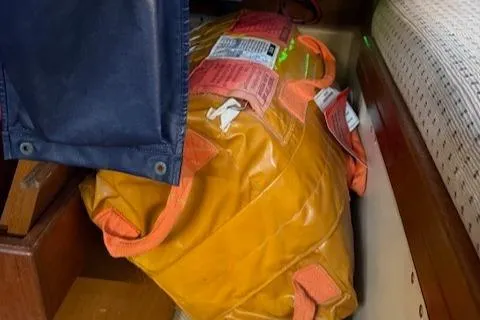 Windragon Yacht Photos Pics Orange safety equipment stored on a 1995 Island Packet 37 sailboat.