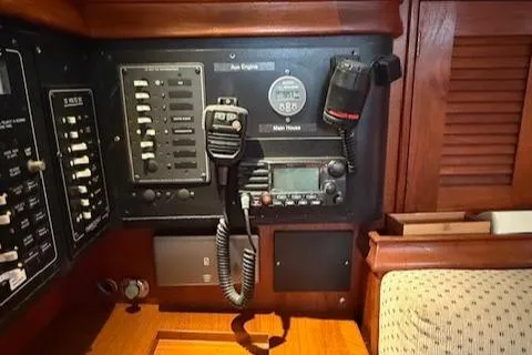 Windragon Yacht Photos Pics Control panel of a 1995 Island Packet 37 sailboat with radio and switches.