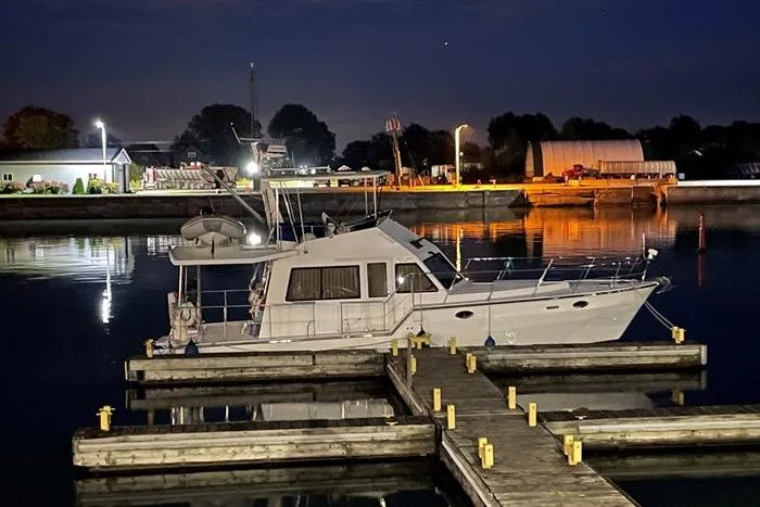  Yacht Photos Pics 2007 Island Pilot 395 yacht docked at night in a serene marina setting.