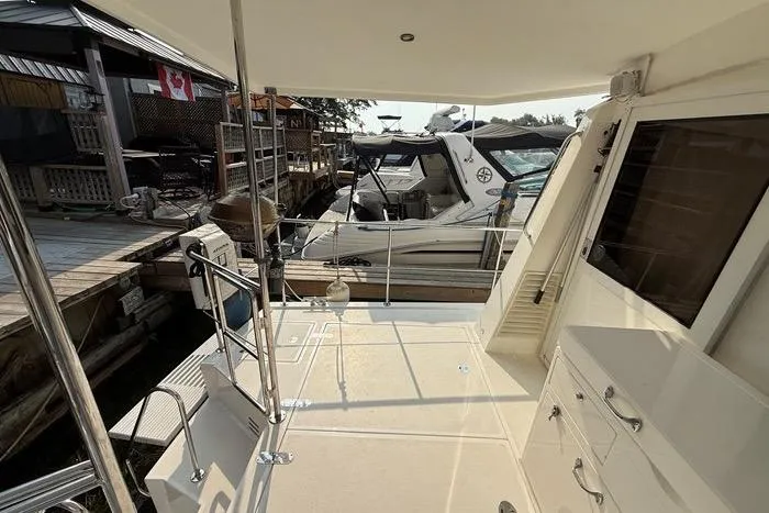  Yacht Photos Pics 2007 Island Pilot 395 boat docked at marina, featuring spacious deck and modern design.