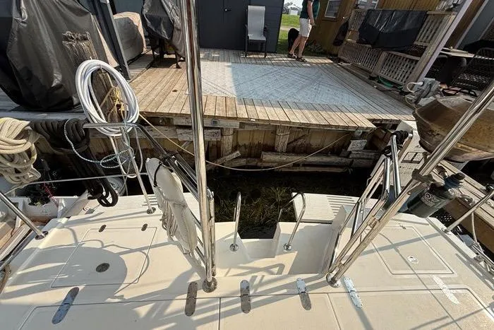  Yacht Photos Pics 2007 Island Pilot 395 yacht docked, showing deck and mooring area with ropes and equipment.