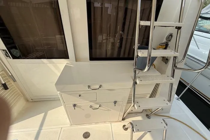  Yacht Photos Pics 2007 Island Pilot 395 yacht deck with ladder and storage cabinet.