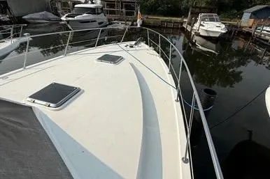  Yacht Photos Pics 2007 Island Pilot 395 yacht docked at a marina, showcasing its sleek deck design.