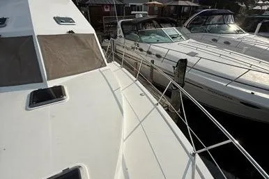  Yacht Photos Pics 2007 Island Pilot 395 yacht docked alongside other boats in a marina.