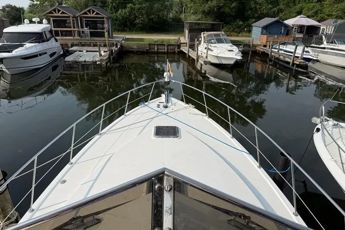  Yacht Photos Pics 2007 Island Pilot 395 docked at a marina, surrounded by other boats.