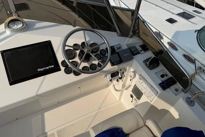  Yacht Photos Pics 2007 Island Pilot 395 helm with steering wheel and navigation equipment.