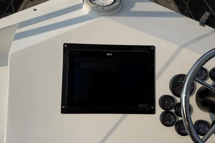  Yacht Photos Pics 2007 Island Pilot 395 dashboard with steering wheel and gauges.