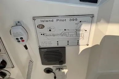  Yacht Photos Pics Control panel of a 2007 Island Pilot 395 boat with diagram and microphone.