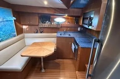  Yacht Photos Pics 2007 Island Pilot 395 yacht interior with dining area and kitchenette.