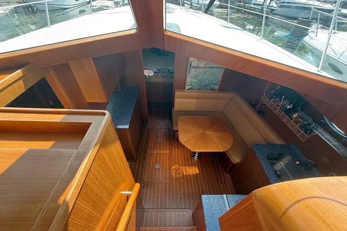  Yacht Photos Pics Interior of 2007 Island Pilot 395 yacht with wood finish and seating area.