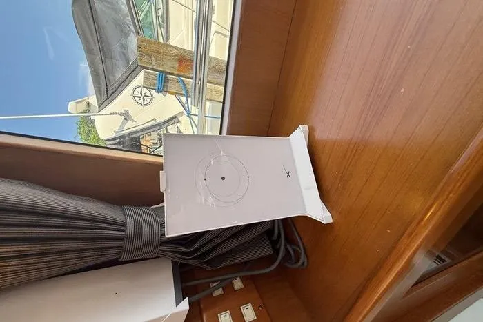  Yacht Photos Pics Interior view of a 2007 Island Pilot 395 yacht with a window and curtain.