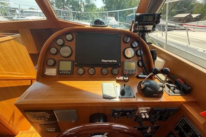  Yacht Photos Pics 2007 Island Pilot 395 helm with Raymarine navigation system and control panel.