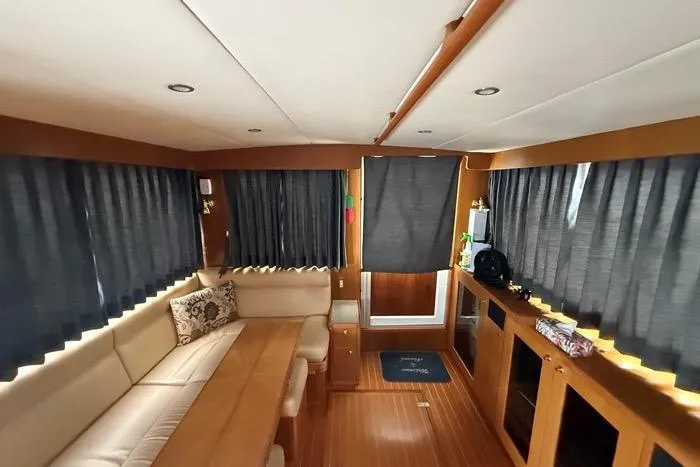  Yacht Photos Pics Interior of 2007 Island Pilot 395 yacht with wood accents and comfortable seating.