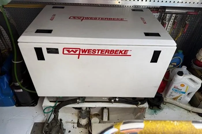  Yacht Photos Pics Westerbeke generator in 2007 Island Pilot 395 engine room, surrounded by maintenance supplies.