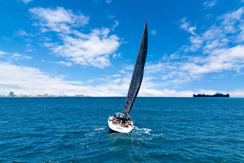 Estela Yacht Photos Pics Grand Soleil 52 Long Cruise sailing on open sea under clear blue sky.